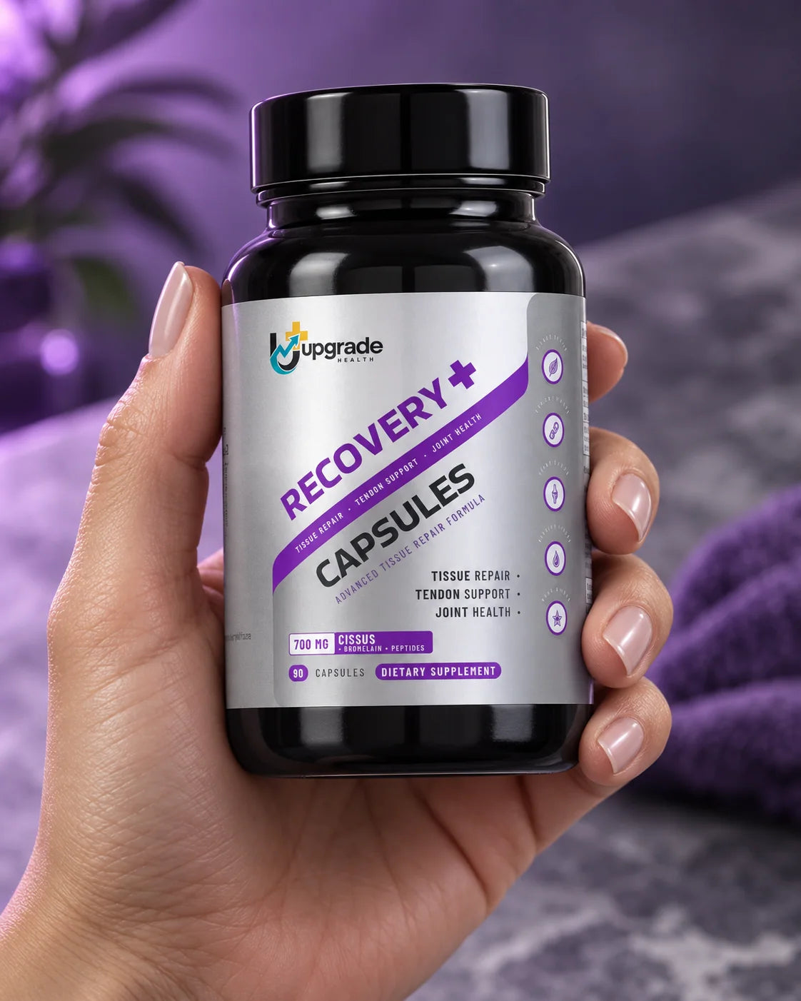 RECOVERY+ bottle held in a hand